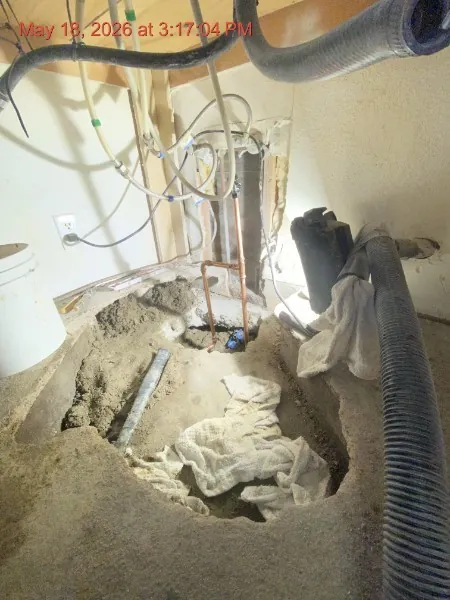 Slab opened during repair — concrete cut at correct location, pipe exposed, Hemet CA